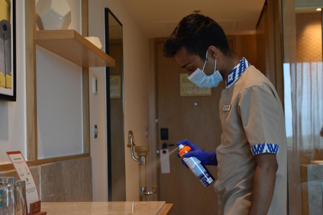 Welcomhotel By Itc Hotels, Racecourse, קוימבטור מראה חיצוני תמונה A hotel employee disinfecting a guest room